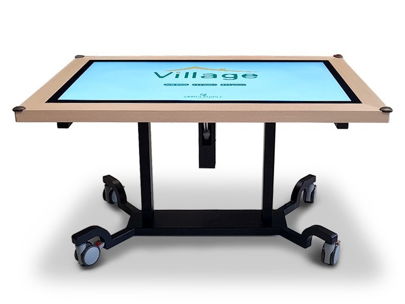 Table tactile multitouch mobile du Village de Verdurable, dotée de roulettes pour une utilisation flexible en milieu thérapeutique.